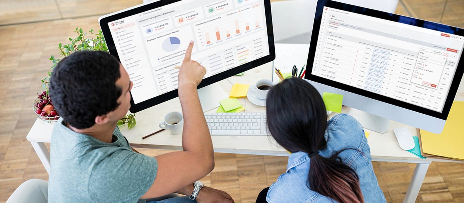 A Finac account manager reviewing the client dashboard and reports on screen with a client